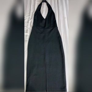 Black midi halter dress with front slit.